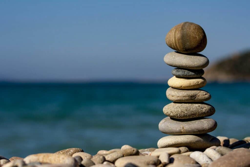 Rock balancing representing mental health stability through CBT